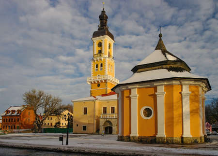 Armenian Well and Town Hall - former Polish magistrate on main square of historic part of Kamianets-Podilskyi, Ukraine on sunny winter dayの写真素材