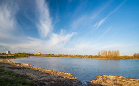 Scenic view of Styr River in Lutsk, Ukraine. Sunny spring day. Picturesque cirrus clouds.の写真素材