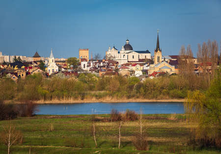 Picturesque view of old town of Lutsk, Ukraine from other side of Styr river. Lubart's Castle, Cathedral of Saints Peter and Paul, Lutheran church and Church of the Intercessionのeditorial素材