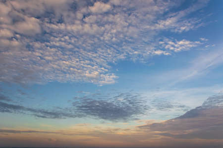 Beautiful sky background with picturesque cirrocumulus clouds during sunset.の写真素材
