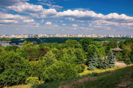 Scenic view on Dnieper hillside in Park of Eternal Glory and left riverside of Dnieper river in Kyiv, Ukraine at sunny summer dayの写真素材