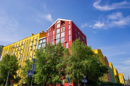 Colorful modern residential building against picturesque sky.の写真素材