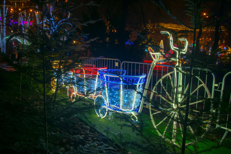 Christmas decoration with illuminated bicycle and carriages. holiday conceptの写真素材