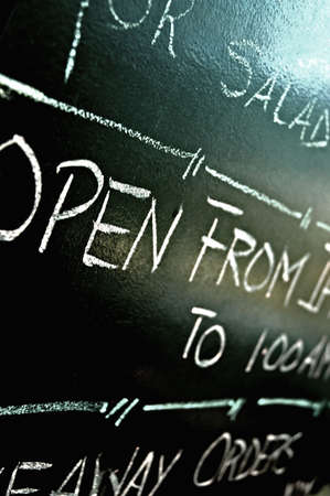 a sign with details outside a coffee shopの写真素材