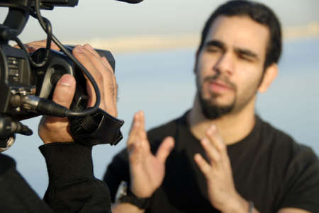 TV Presenter Explaining Convincingly With Hand Gesturesの写真素材