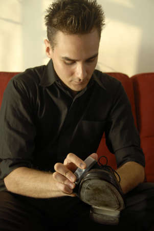 A Brunette Teenager A Polishing Formal Leather Shoeの写真素材