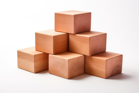Stack of Wooden Blocks. A stack of wooden blocks sits on top of each other in a balanced formation. The blocks vary in size and appear to be made of natural wood.の素材
