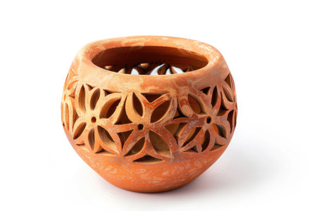 Clay Vase With Flower Design. The intricate details of the design are meticulously etched into the surface of the vase showcasing the skill and craftsmanship of the artist.の素材