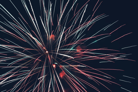 Colorful fireworks on the black sky background, celebrating new year.の写真素材
