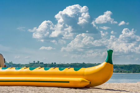 Inflatable water sledge on the shore of a bayの写真素材
