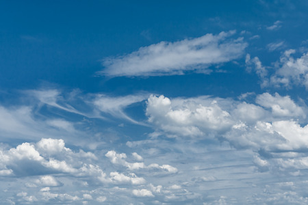 Picturesque clouds on a blue sky on a windy dayの写真素材