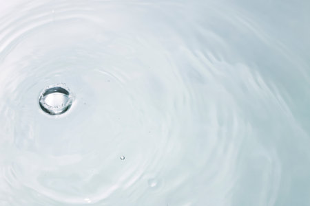 drop of water on a white background, close-up, macroの写真素材
