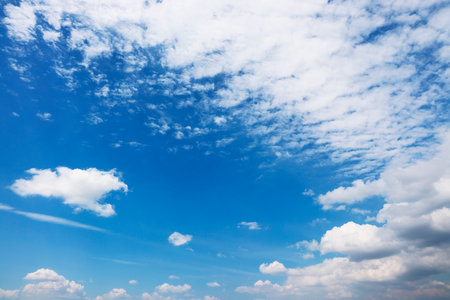 Blue sky background with tiny clouds. The vast blue sky and clouds sky on sunny day.の写真素材