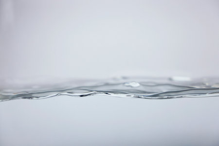 water wave close-up on a white background.の写真素材