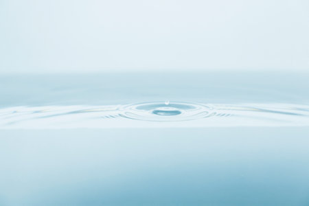 drop of water on a blue background, close-up, macroの写真素材