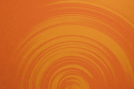 Orange paper background with concentric circles. Copy space for text.の写真素材
