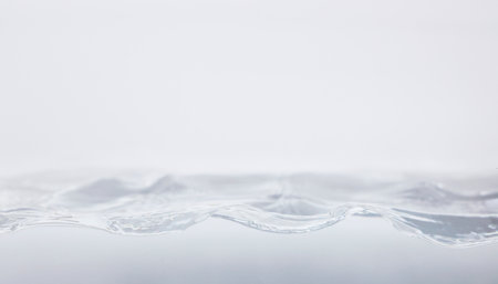 Water splash isolated on white background. Close up of water wave.