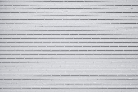 White brick wall texture. Abstract background for design with copy space.の写真素材