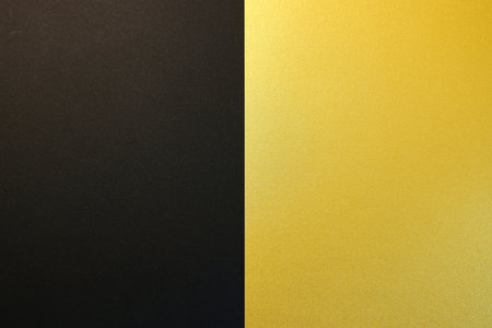 Gold and black paper background with copy space for text or image.の写真素材