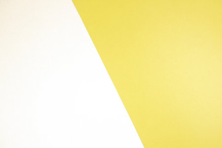 White and yellow paper background with copy space for text or image.