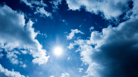 blue sky background with white clouds and sun, nature abstract background.