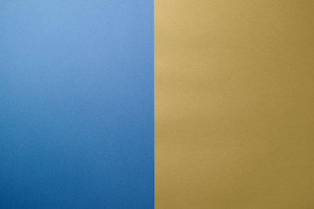 Blue and yellow paper background with copy space for text or image.の写真素材