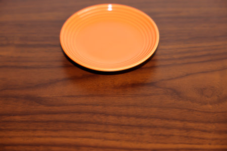 Empty plate on a wooden table.の写真素材