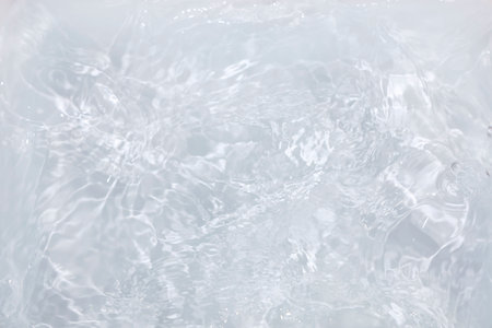 close up of water surface with bubbles in it, abstract background.の写真素材