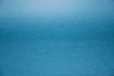 Blue paper texture background with copy space for your text or image.の写真素材
