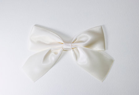 White bow on a white background. White bow on a white background.の写真素材