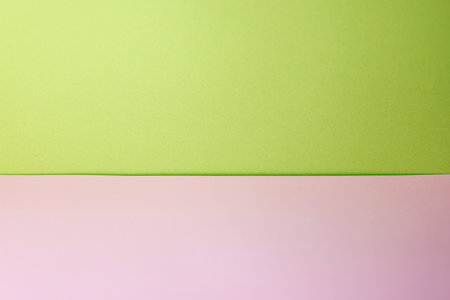 Green and pink paper background with copy space for text or image.の写真素材