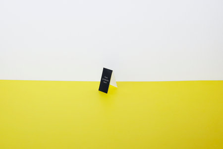 Dummy card on a yellow and white background with space for text.の写真素材