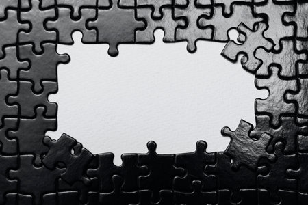 Piece missing from jigsaw puzzle. Black and white tone.の写真素材