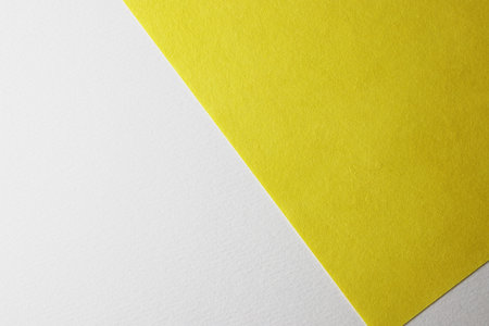 Yellow and white paper background with copy space for text or image.の写真素材