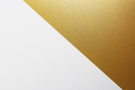 Gold and white paper background. Copy space for your text or design.