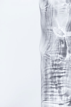 Close-up of water surface on white background with copy space.の写真素材