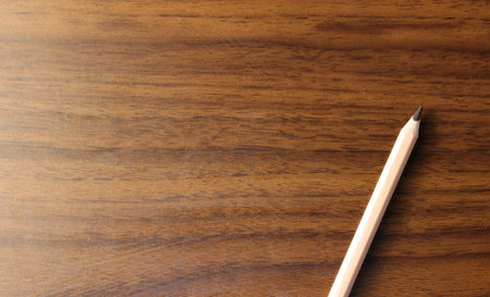 pencil on wood texture background with copy space for add text or something elseの写真素材