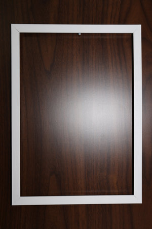 White frame on the wood texture background. White frame on the wood texture background.