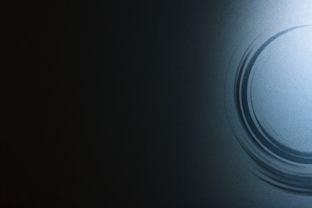 Black and navy background with some smooth lines in it and a circle