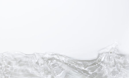 close up of water splashing on white background with copy space.の写真素材