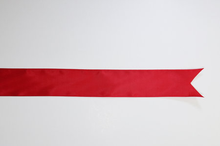 Red ribbon isolated on white background with copy space for your text.