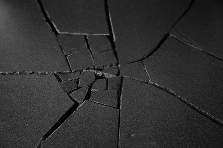 Cracks in the wall. Black and white photo. Abstract background.の写真素材