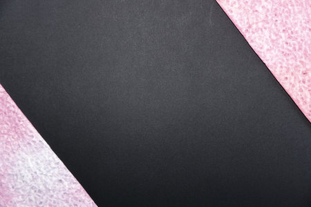 Black and pink paper background with copy space for text or image.