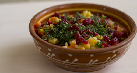 salad vegetables on the plate on the tableの写真素材