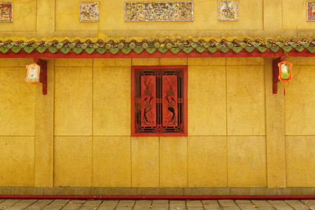 Walkway corridor behind red windowの写真素材