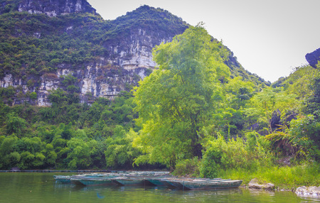 Traditional longtail boats at riverの写真素材