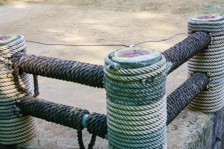 Fence wrapped with ropeの写真素材