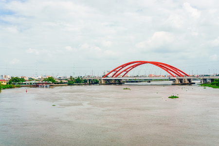 Landscape of the river and the red bridgeの写真素材