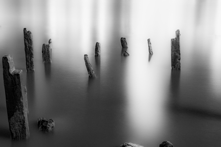 Long exporsure of river with wood pilesの写真素材