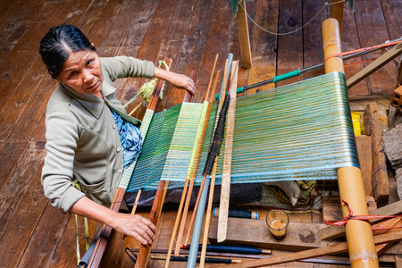 The woman weaves traditional fabric in Da Lat Vietnamのeditorial素材
